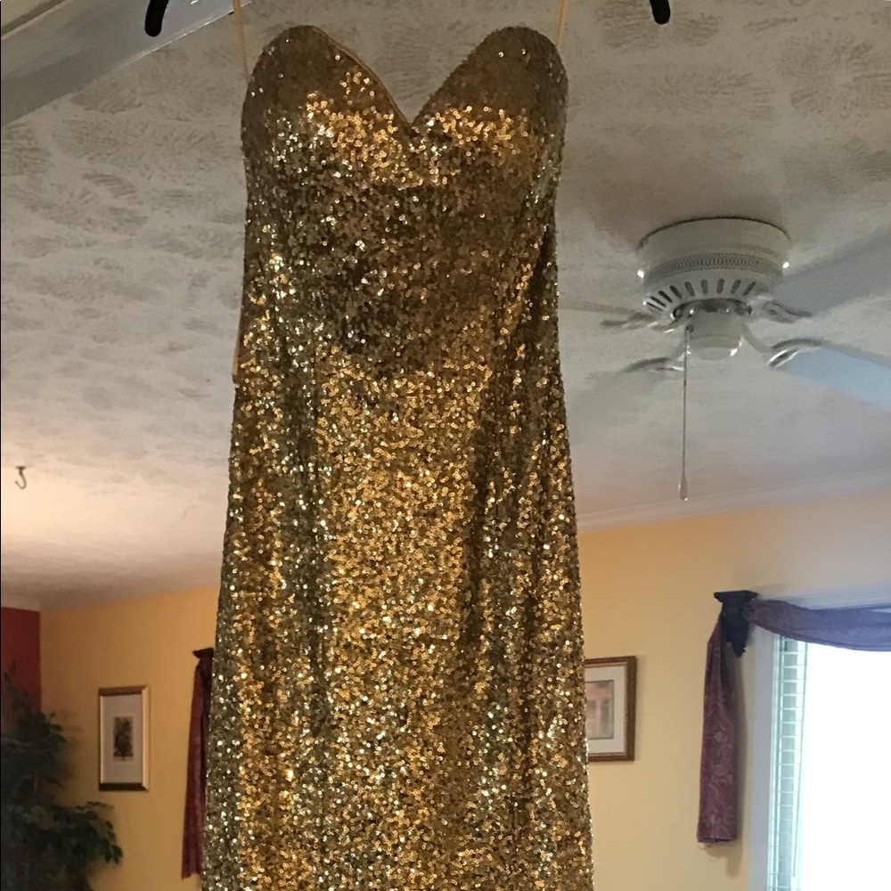 A formal dress. Size 4. Gold sequins.